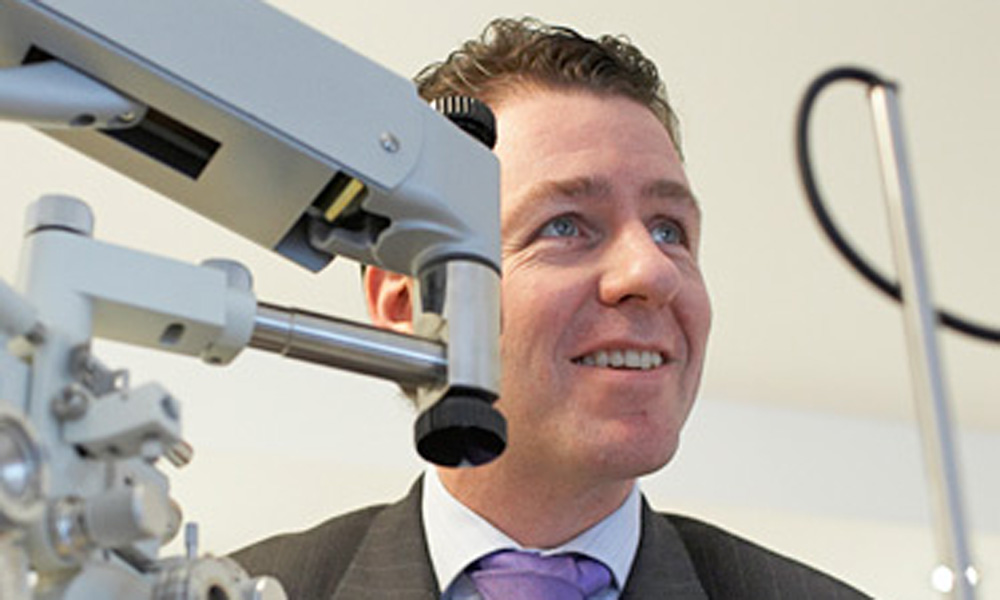 Optometrist consulting eye surgery patient Brendan Duane